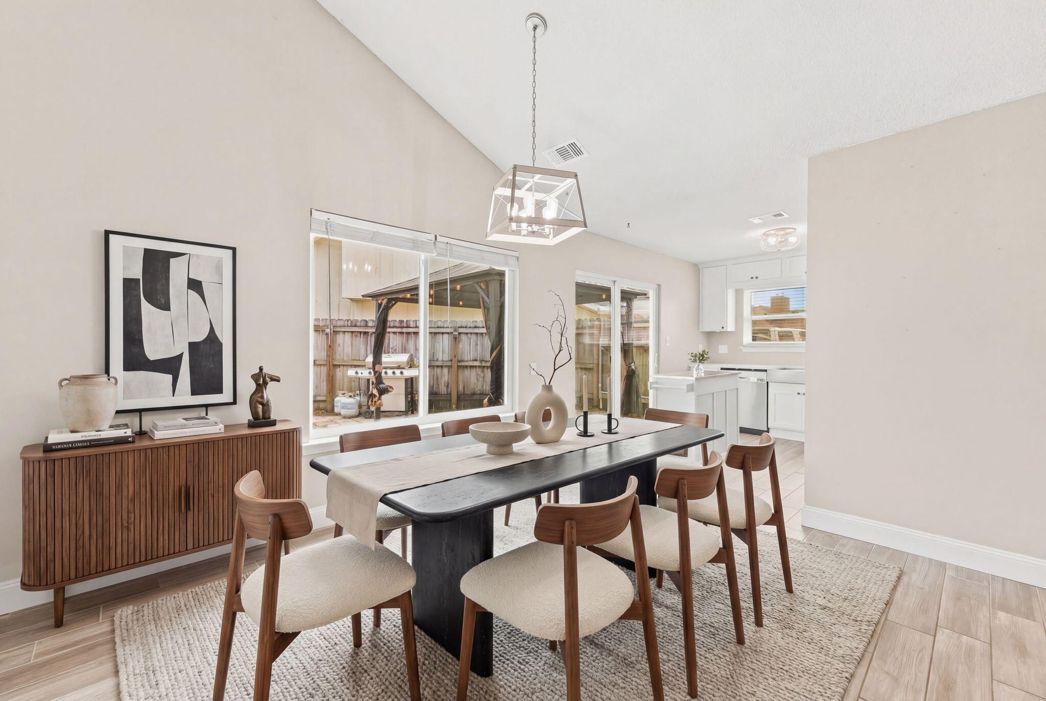 1833 Hunters Path Fort Walton Beach, FL 32547 - Photo 13 of 43 a view of a dining room with furniture window and wooden floor