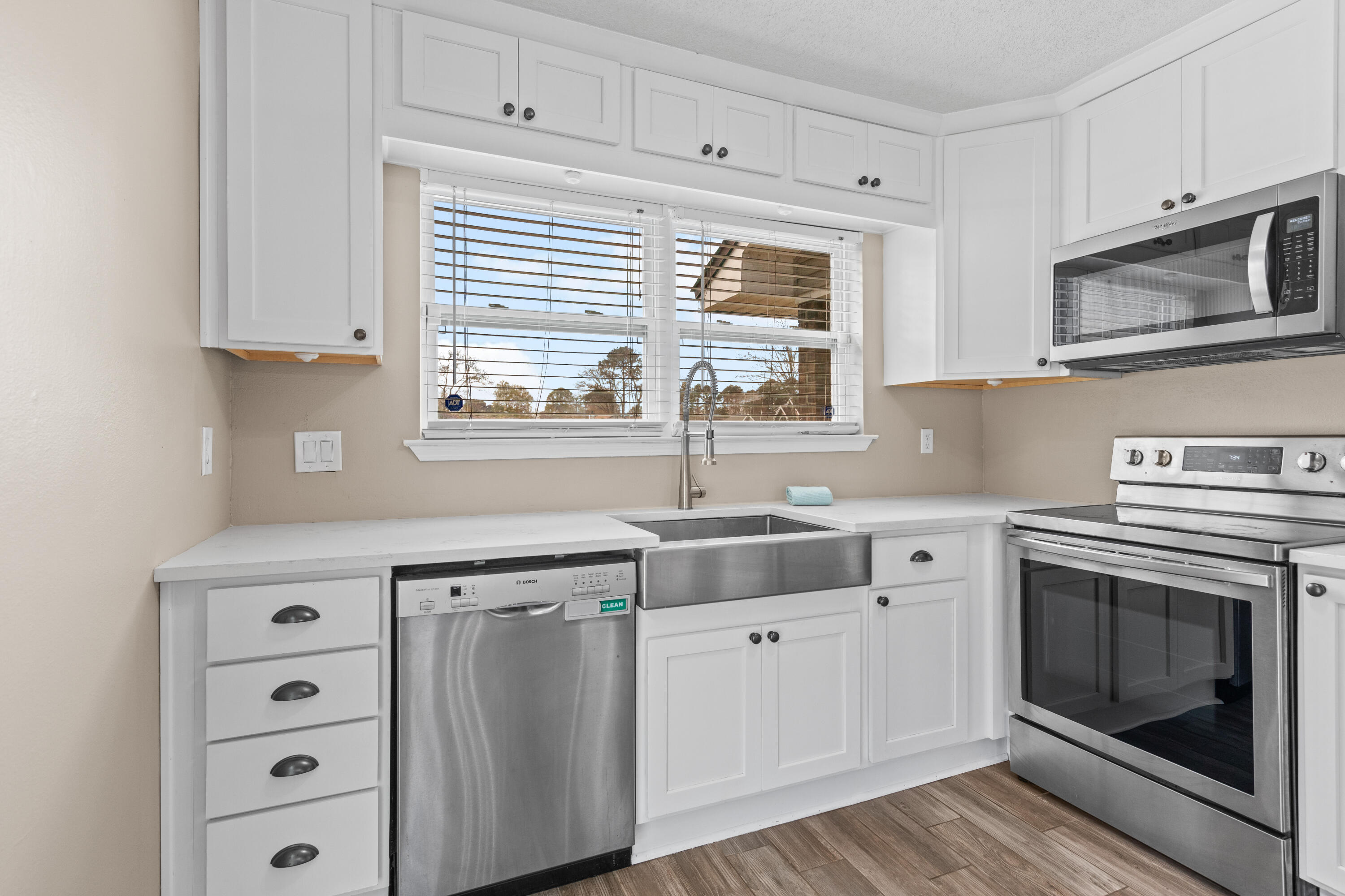 1833 Hunters Path Fort Walton Beach, FL 32547 - Photo 17 of 43 a kitchen with cabinets stainless steel appliances and a window