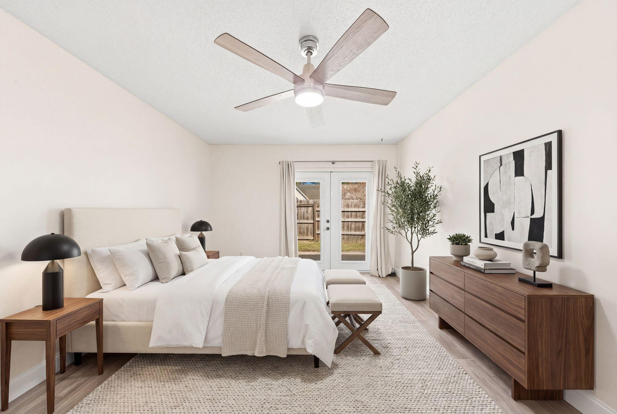1833 Hunters Path Fort Walton Beach, FL 32547 - Photo 23 of 43 a spacious bedroom with a bed and glass window