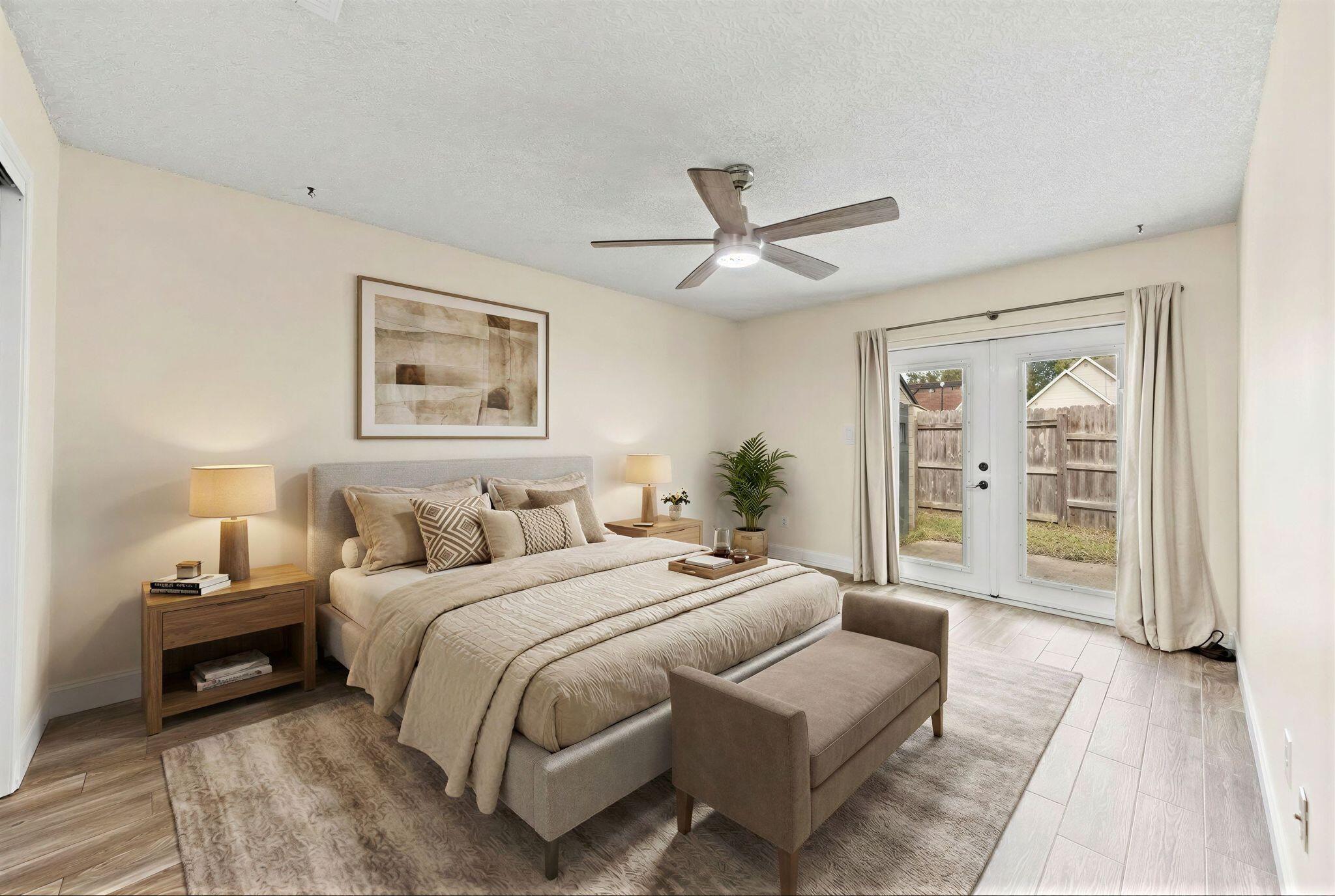 1833 Hunters Path Fort Walton Beach, FL 32547 - Photo 24 of 43 a spacious bedroom with a large bed a chandelier and closet