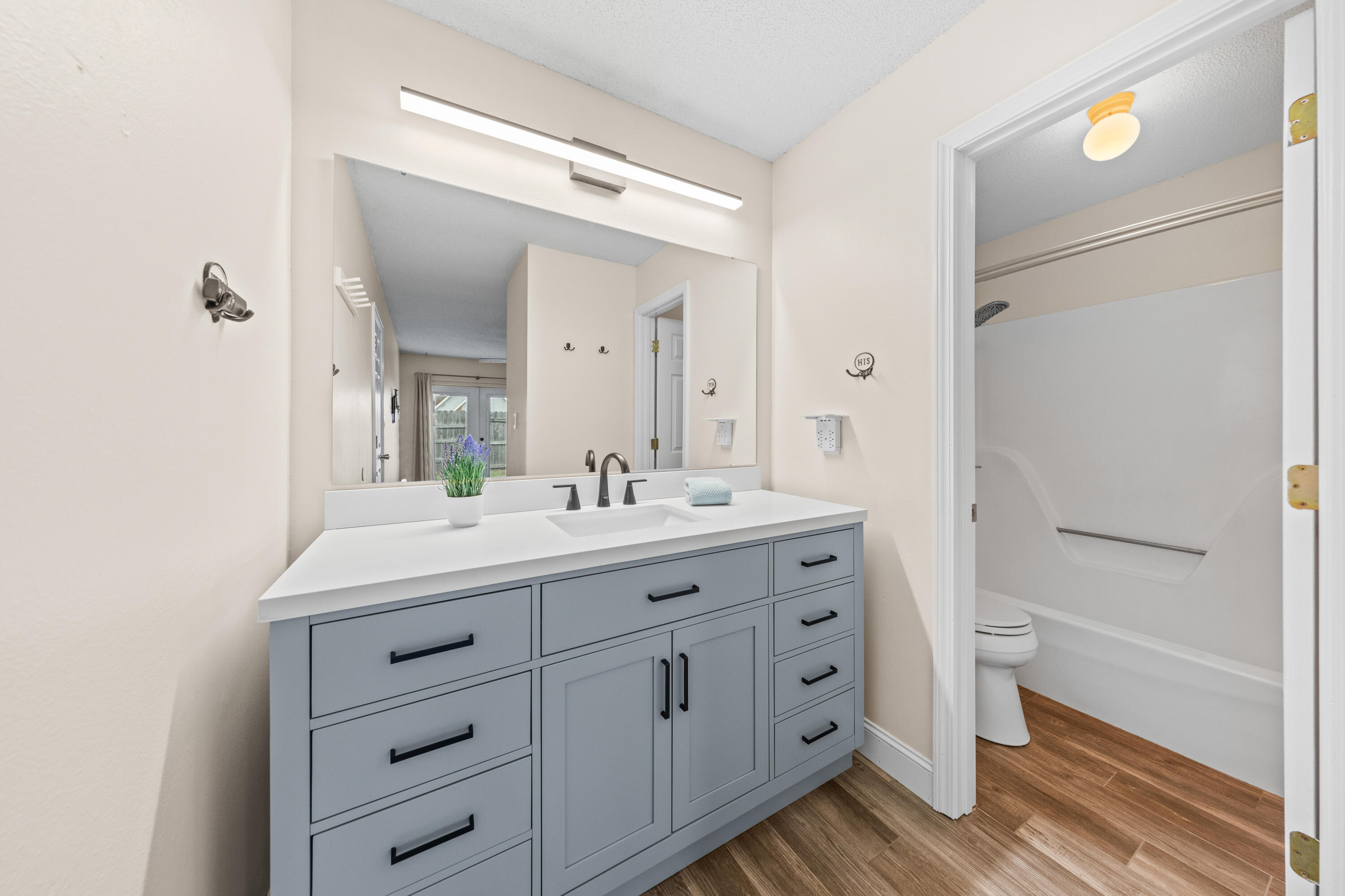 1833 Hunters Path Fort Walton Beach, FL 32547 - Photo 25 of 43 a bathroom with a double vanity sink and mirror