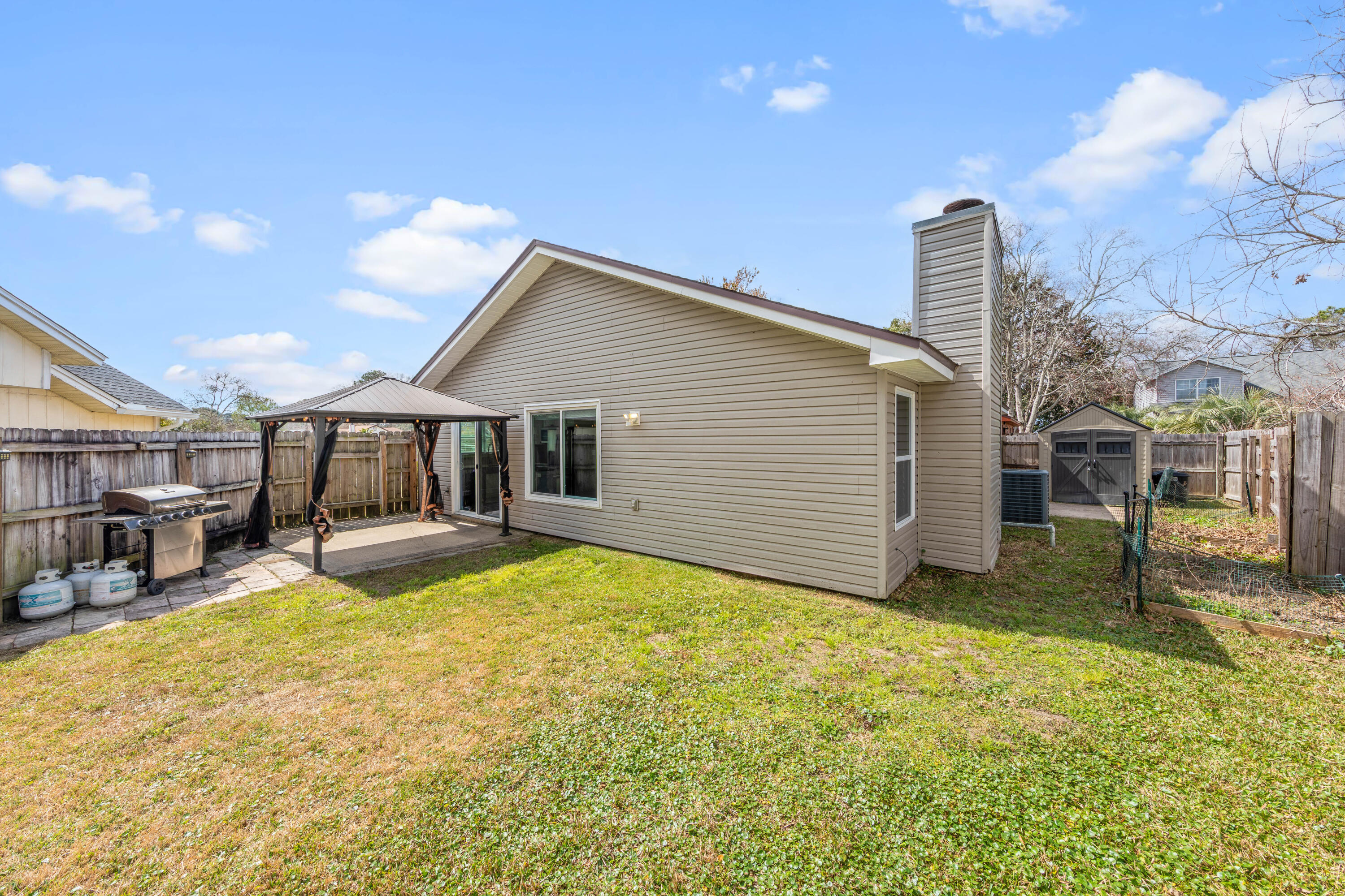 1833 Hunters Path Fort Walton Beach, FL 32547 - Photo 41 of 43 a view of a house with a yard and sitting area