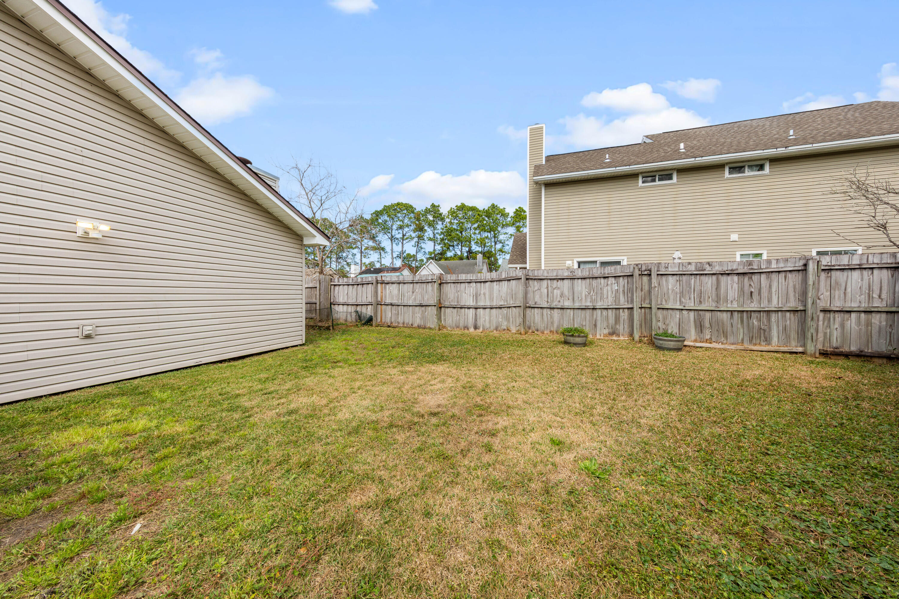 1833 Hunters Path Fort Walton Beach, FL 32547 - Photo 42 of 43 a view of backyard and wooden fence