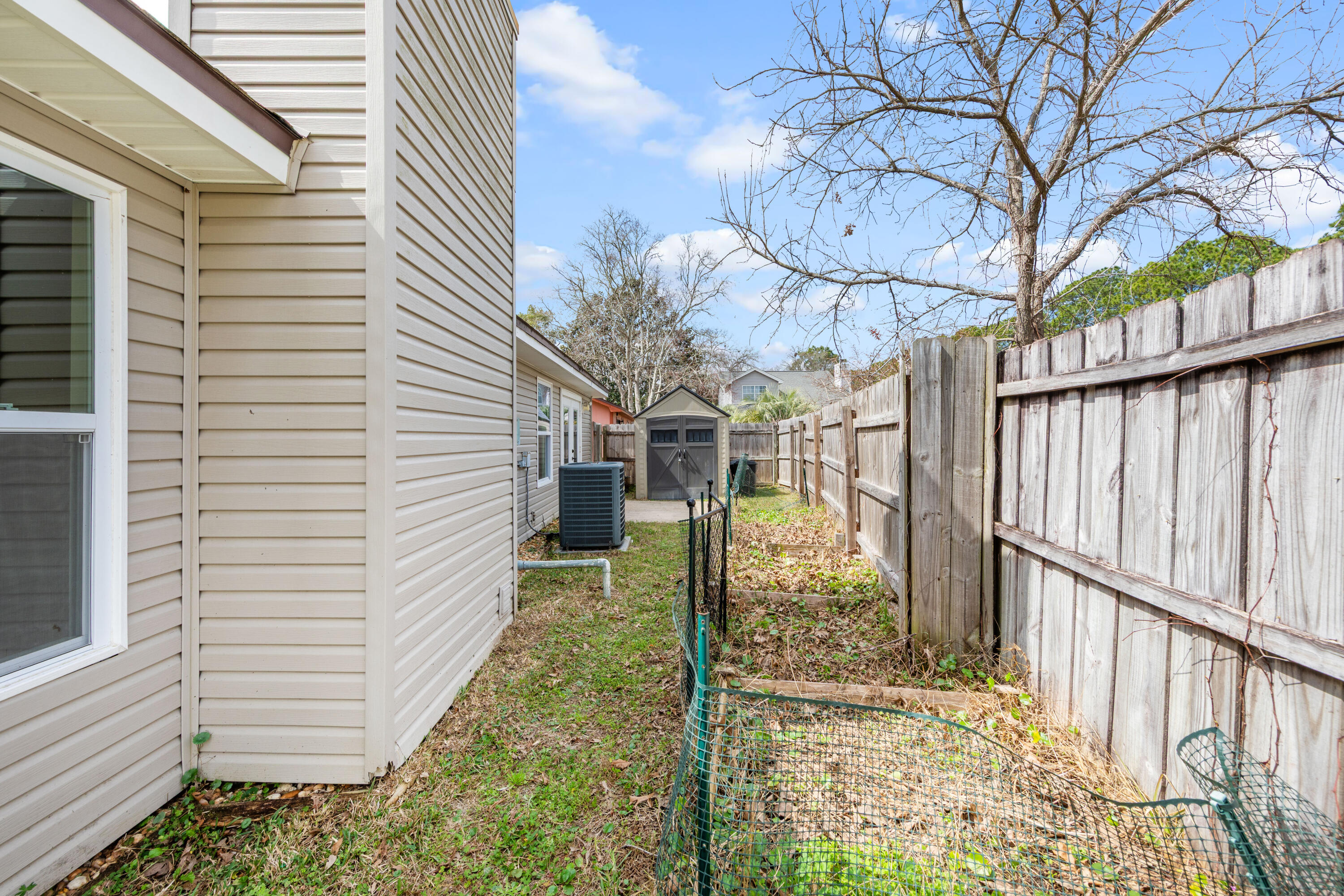 1833 Hunters Path Fort Walton Beach, FL 32547 - Photo 43 of 43 a view of a pathway of a house with wooden fence