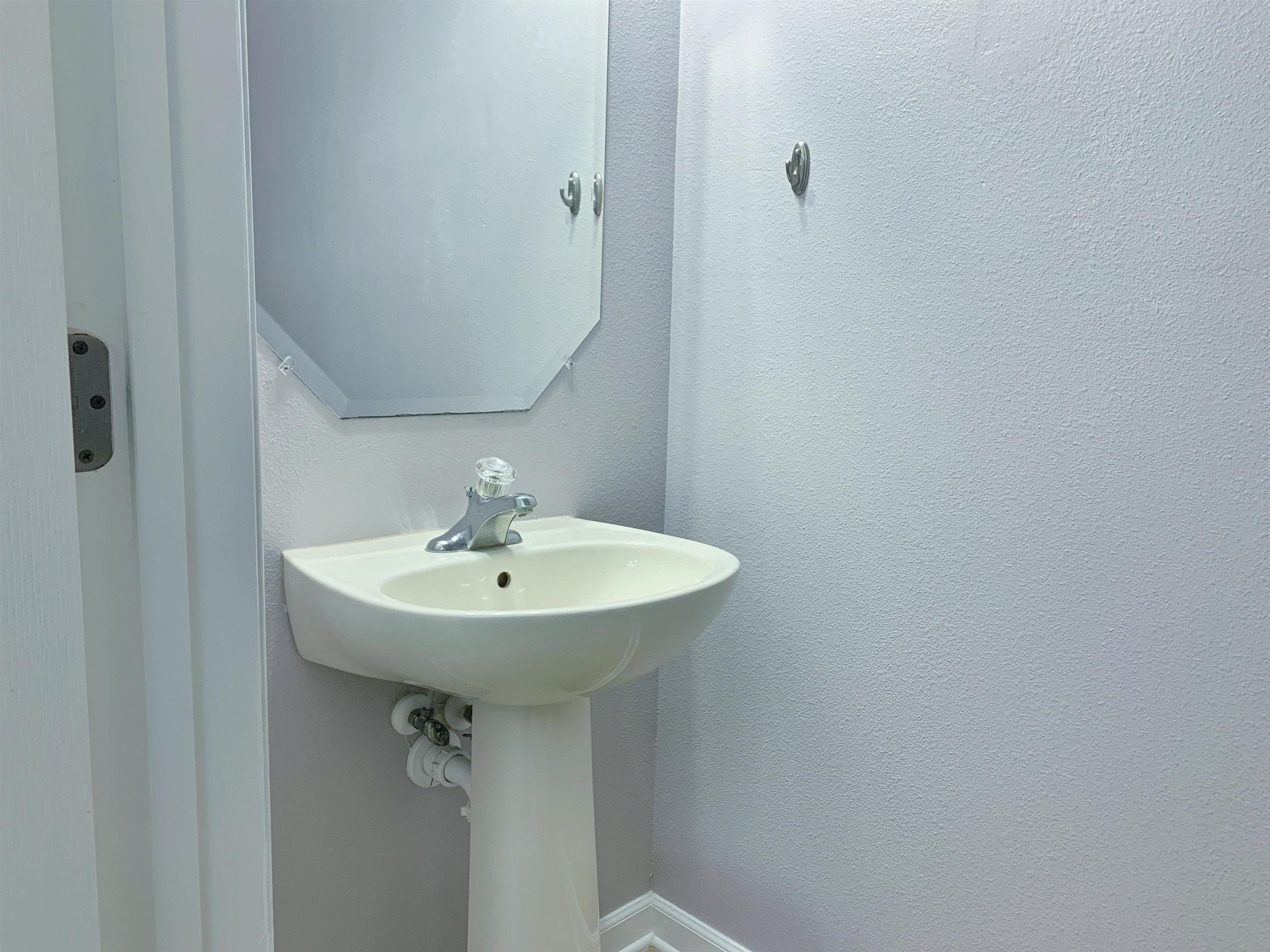 237 Syrah Way St. Augustine, FL 32084 - Photo 13 of 26 a sink with a mirror