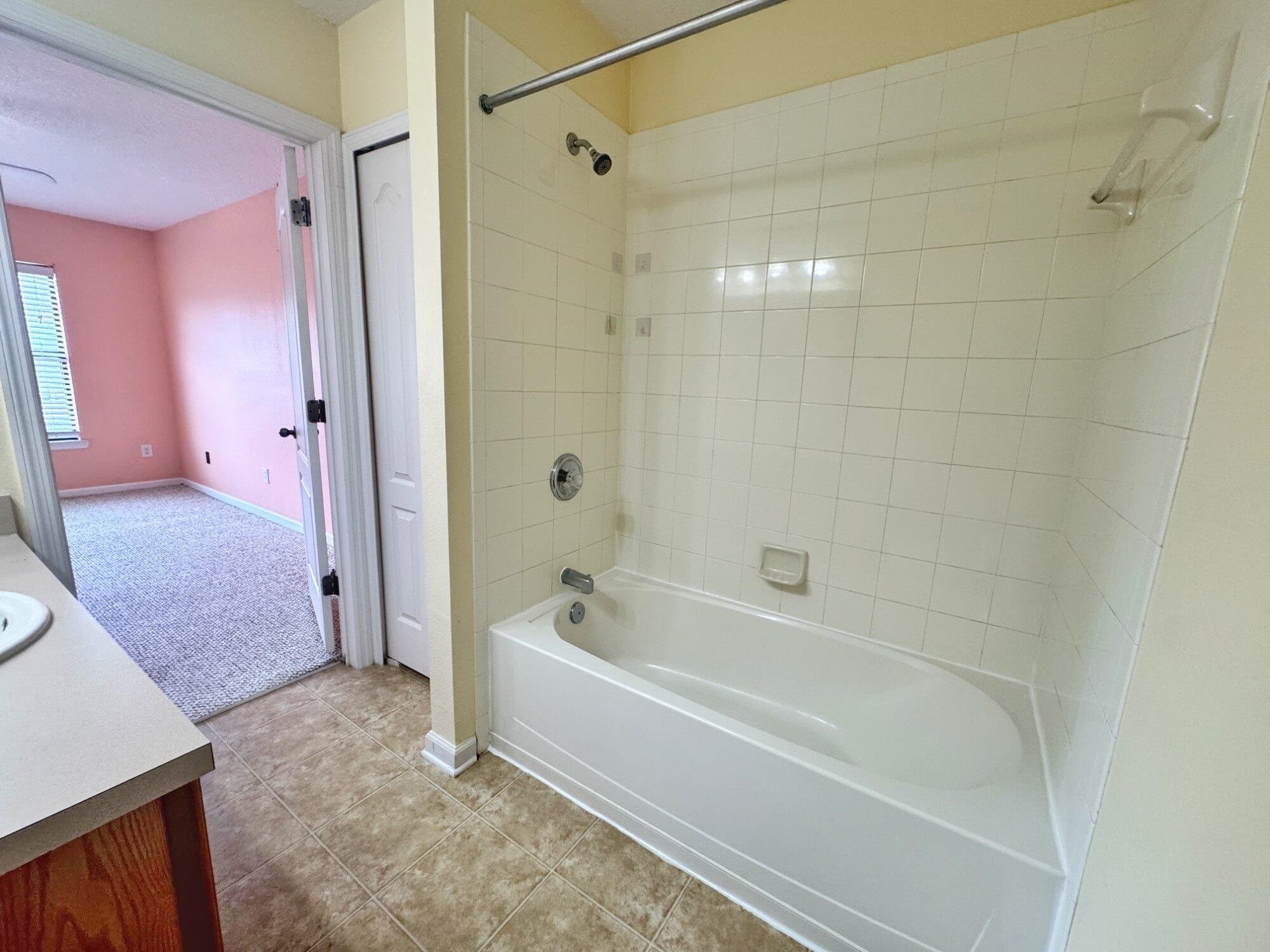 237 Syrah Way St. Augustine, FL 32084 - Photo 17 of 26 a spacious bathroom with a bathtub and a shower