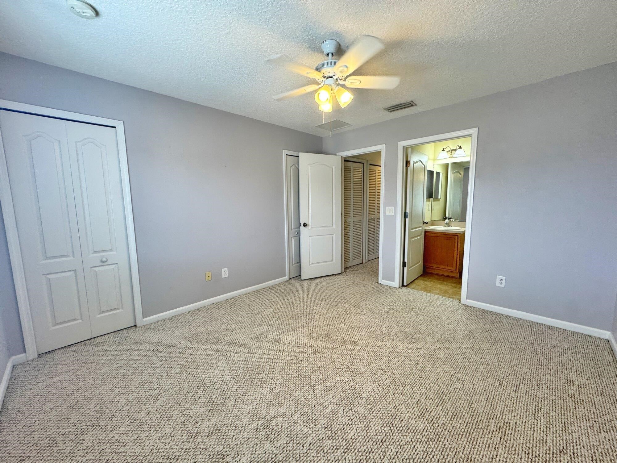 237 Syrah Way St. Augustine, FL 32084 - Photo 20 of 26 a view of an empty room with a chandelier fan