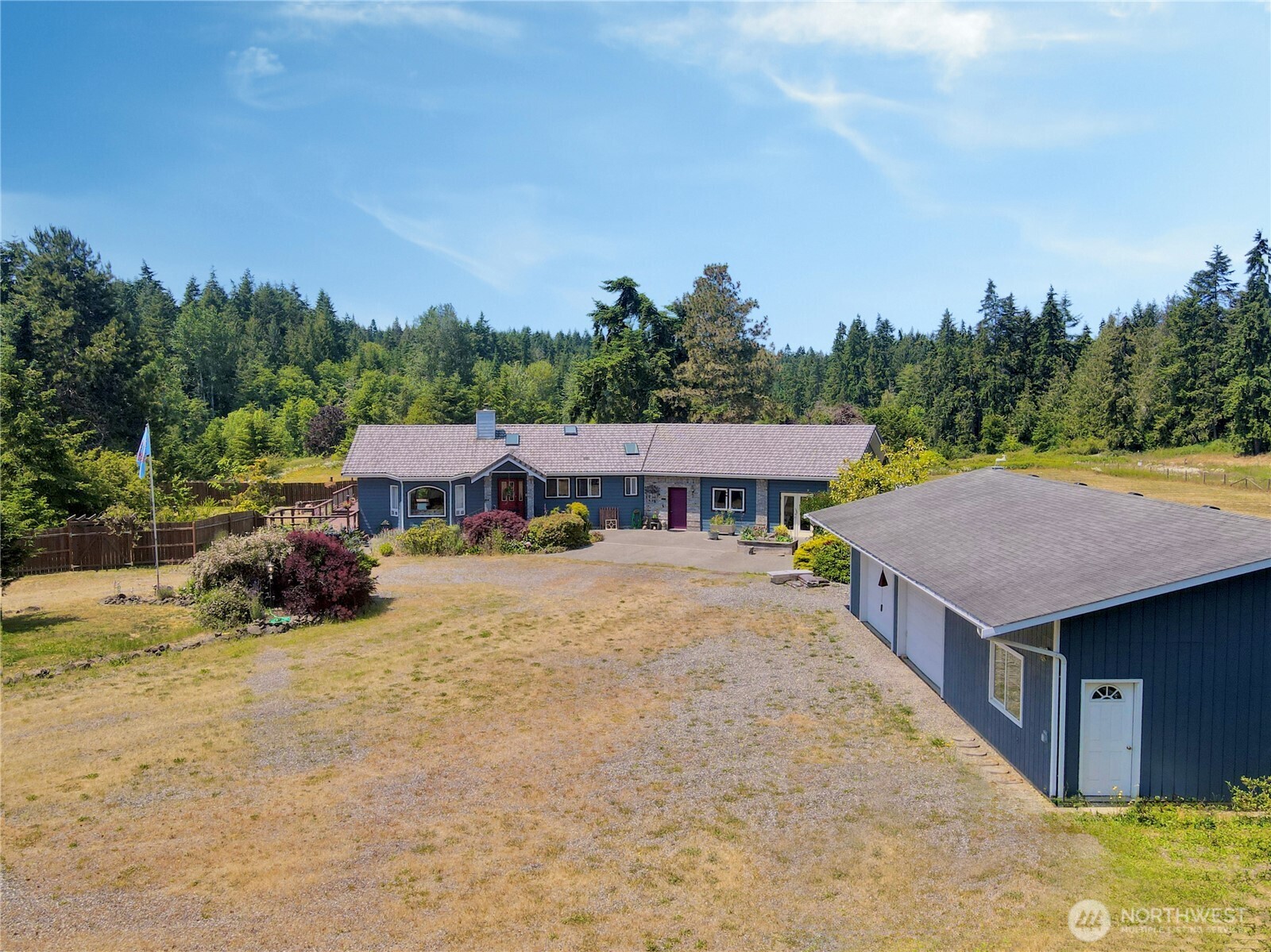 10 Davenhill Lane Sequim, WA 98382 - Photo 2 of 39 an aerial view of a house with swimming pool and sitting area