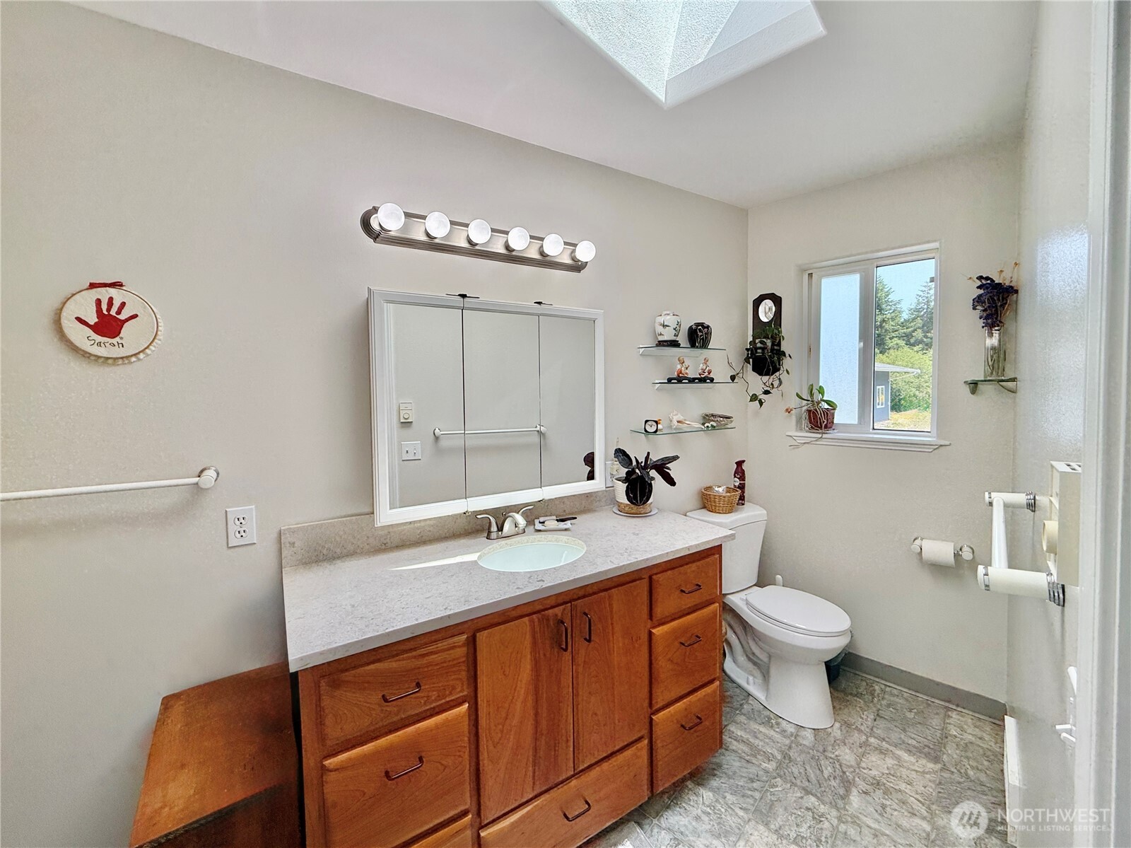 10 Davenhill Lane Sequim, WA 98382 - Photo 22 of 39 a bathroom with a sink a toilet and a mirror
