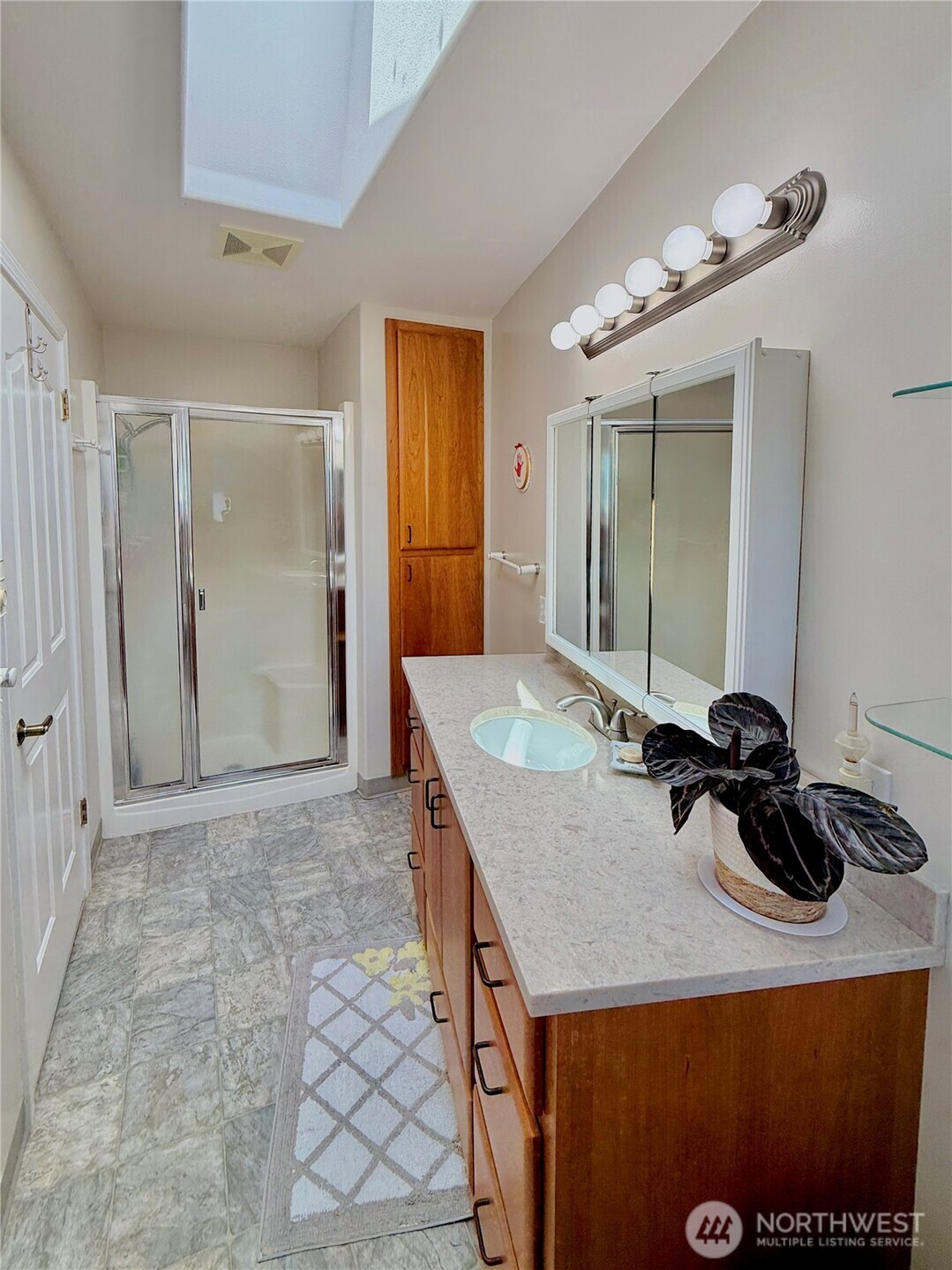 10 Davenhill Lane Sequim, WA 98382 - Photo 23 of 39 a kitchen with a sink a stove and cabinets