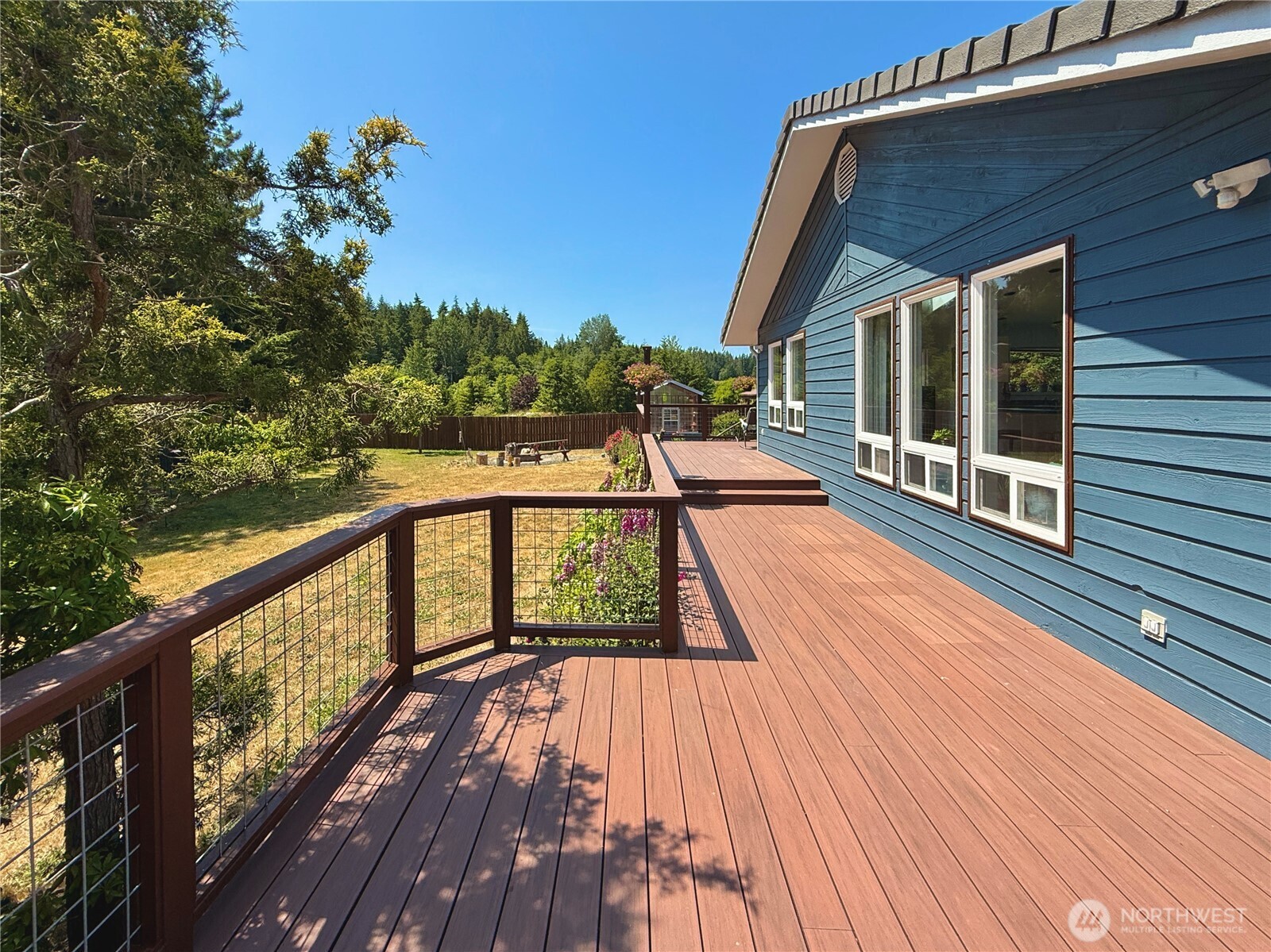 10 Davenhill Lane Sequim, WA 98382 - Photo 27 of 39 a view of a balcony with wooden floor and iron fence