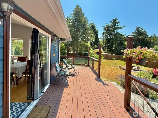 city view of balcony with wooden floor and seating space