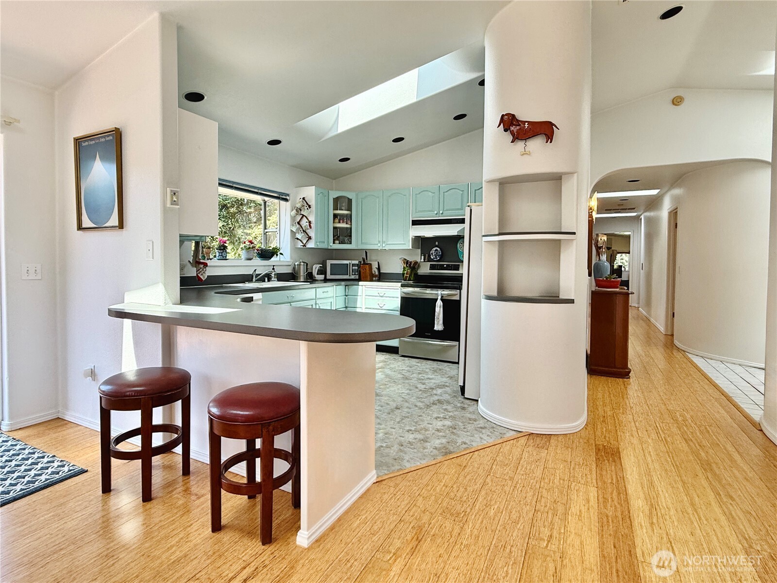 10 Davenhill Lane Sequim, WA 98382 - Photo 6 of 39 a kitchen with refrigerator and wooden floor