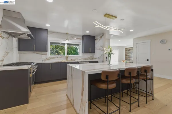 a kitchen with a table and chairs in it