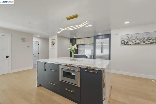 a kitchen with stainless steel appliances granite countertop a stove and a sink