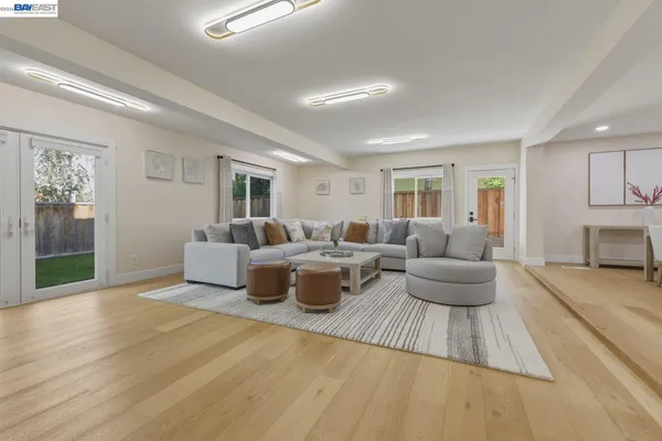 a view of a dining room with furniture and wooden floor