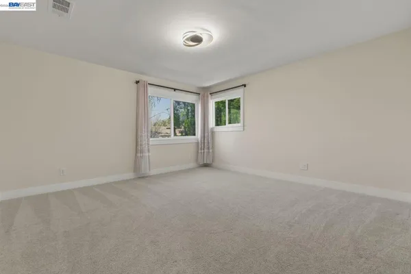 a bedroom with furniture and a chandelier