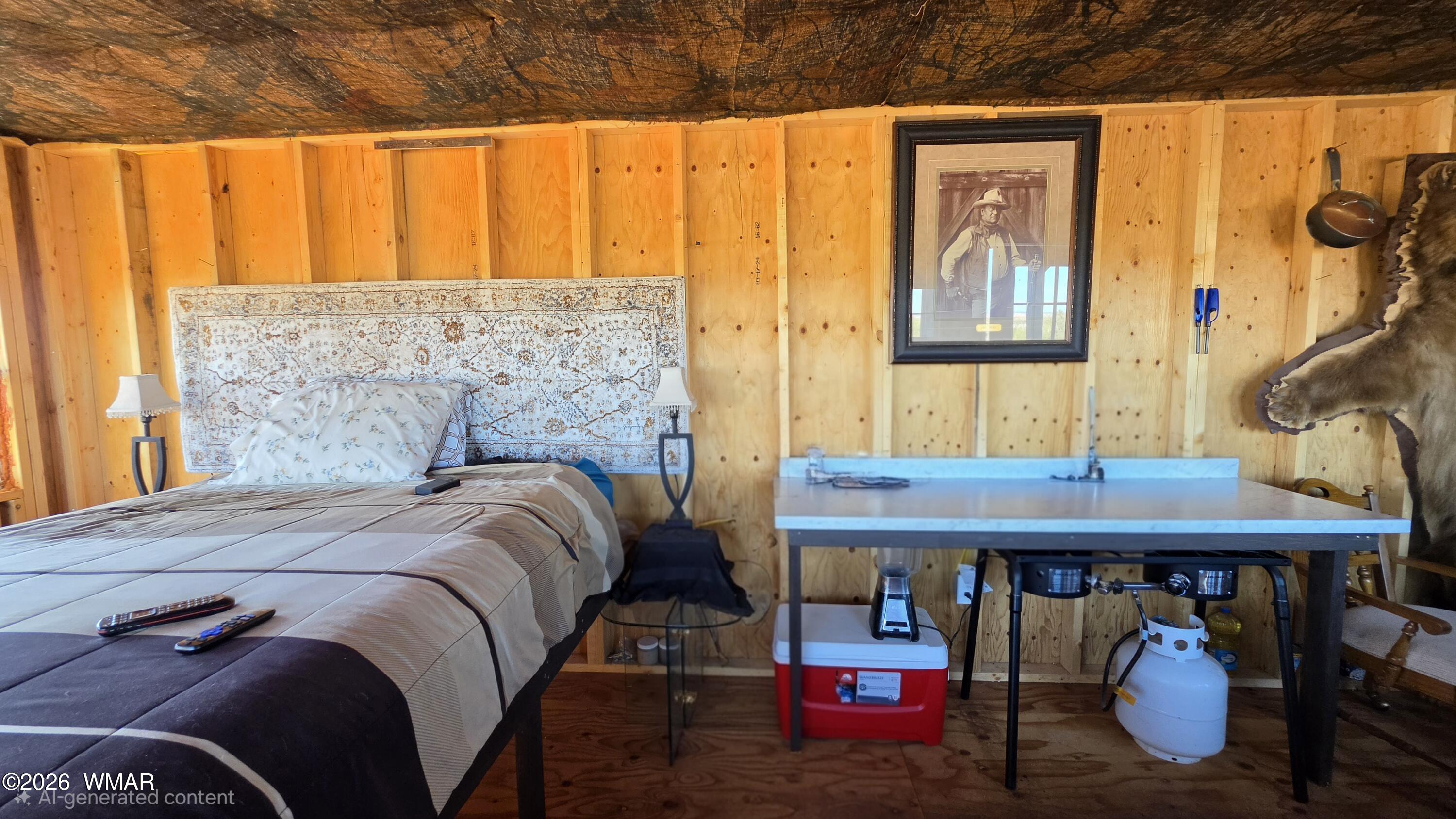 Lot 632 Lazy S Ranch Road Concho, AZ 85924 - Photo 12 of 27 a bed sitting in a bedroom next to a window