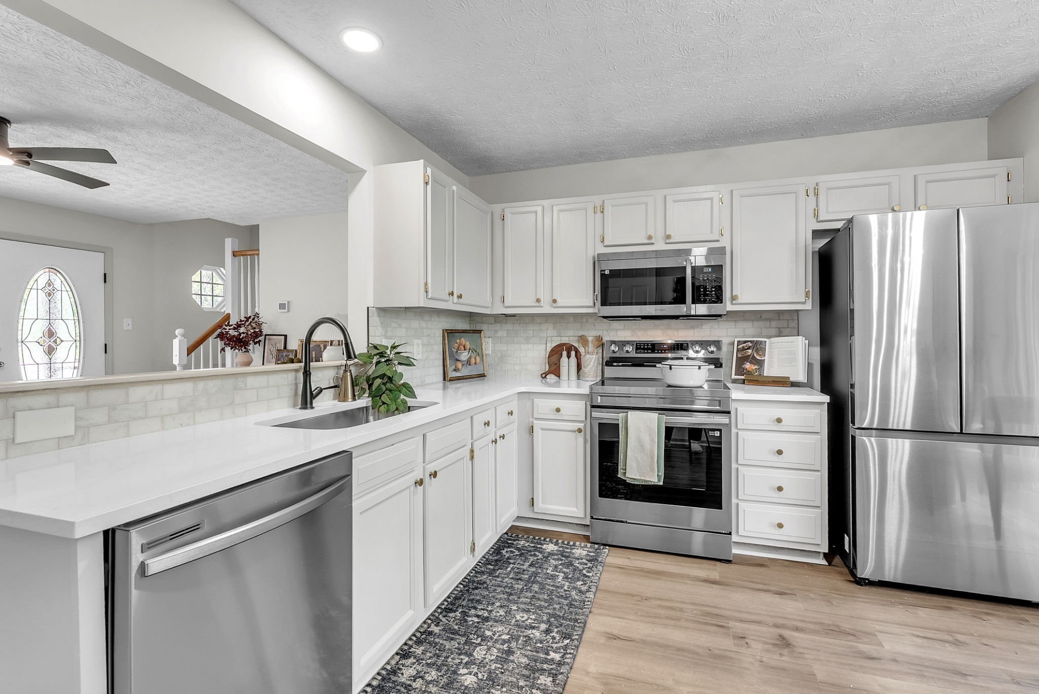 522 Acorn Way Mount Juliet, TN 37122 - Photo 12 of 30 a kitchen with a refrigerator stove and sink