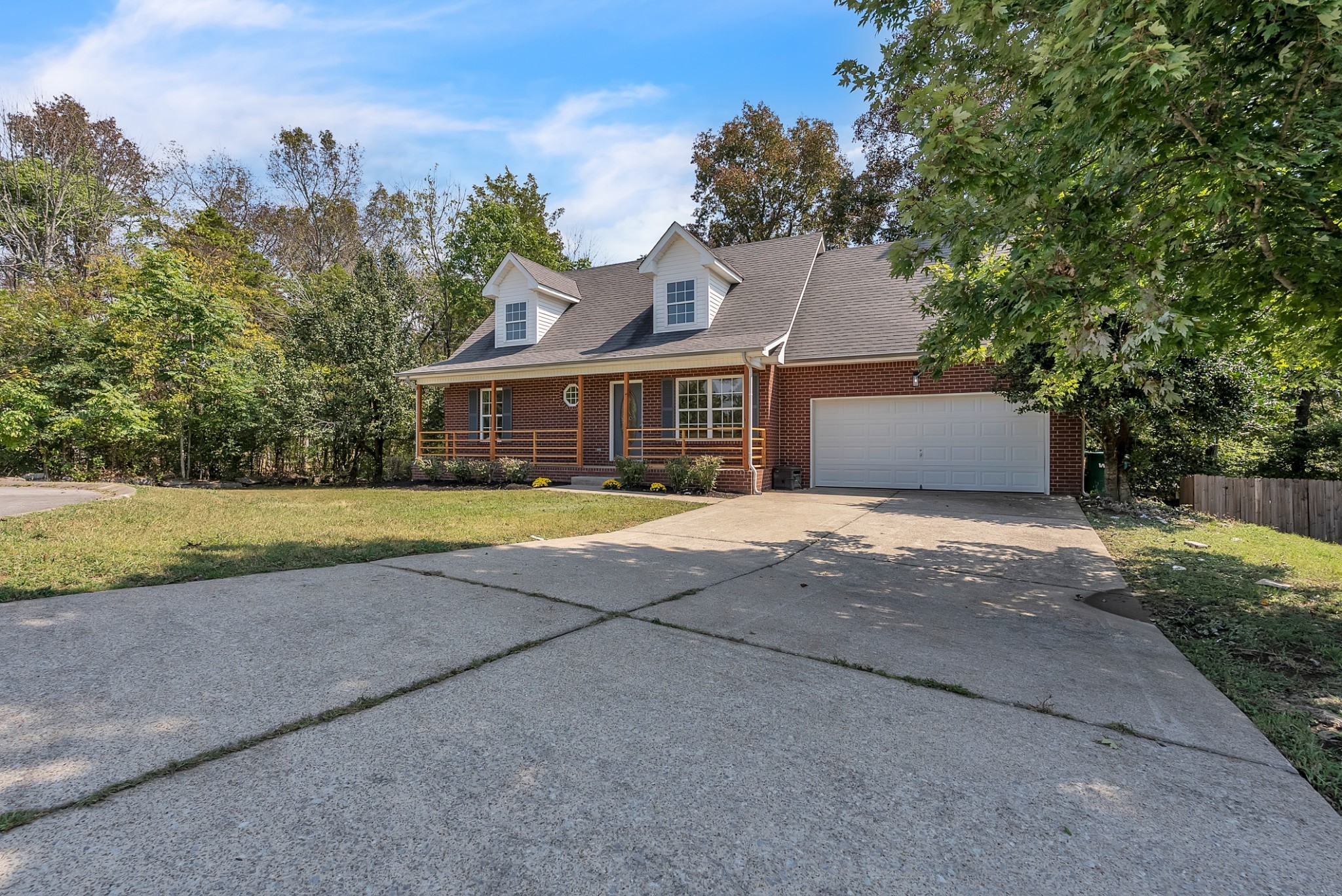 522 Acorn Way Mount Juliet, TN 37122 - Photo 3 of 30 a front view of a house with a yard and trees