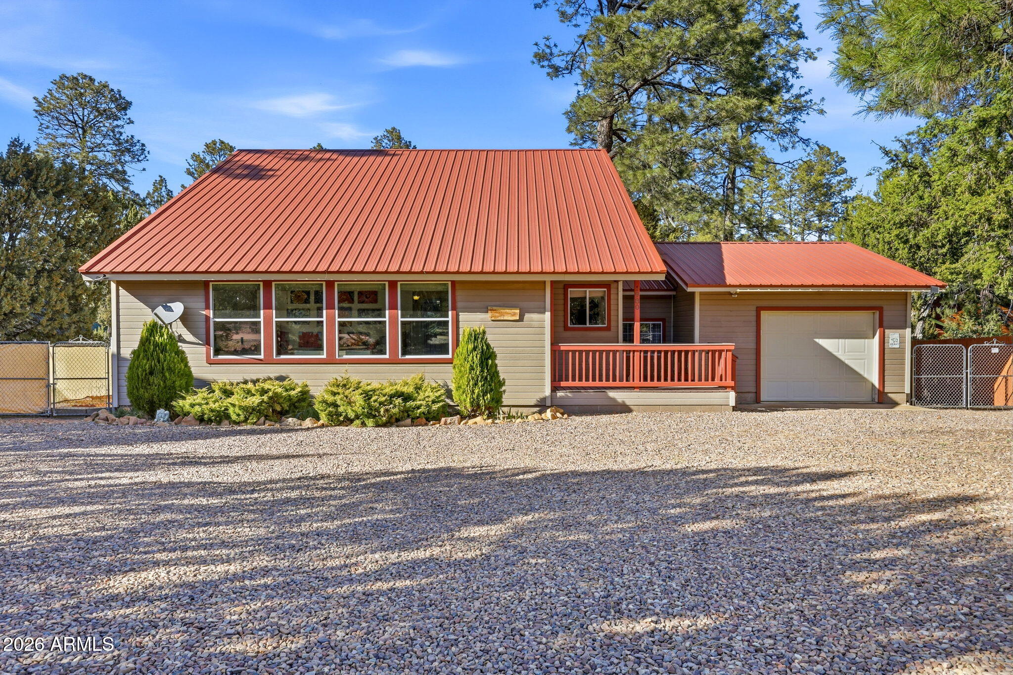 1980 Pine Cone Circle Overgaard, AZ 85933 - Photo 1 of 30 a front view of a house with a garden
