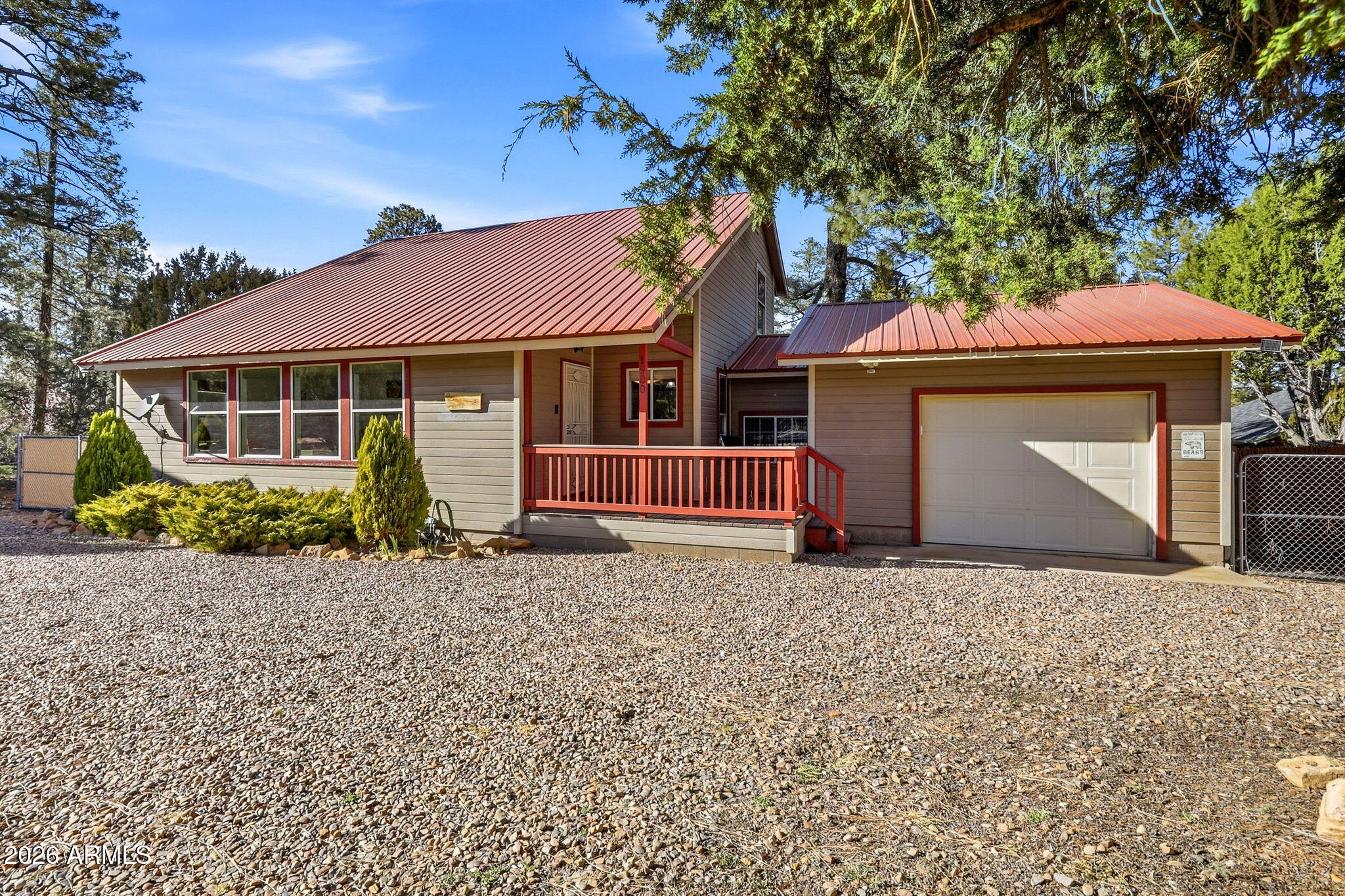 1980 Pine Cone Circle Overgaard, AZ 85933 - Photo 2 of 30 a front view of a house with a garden