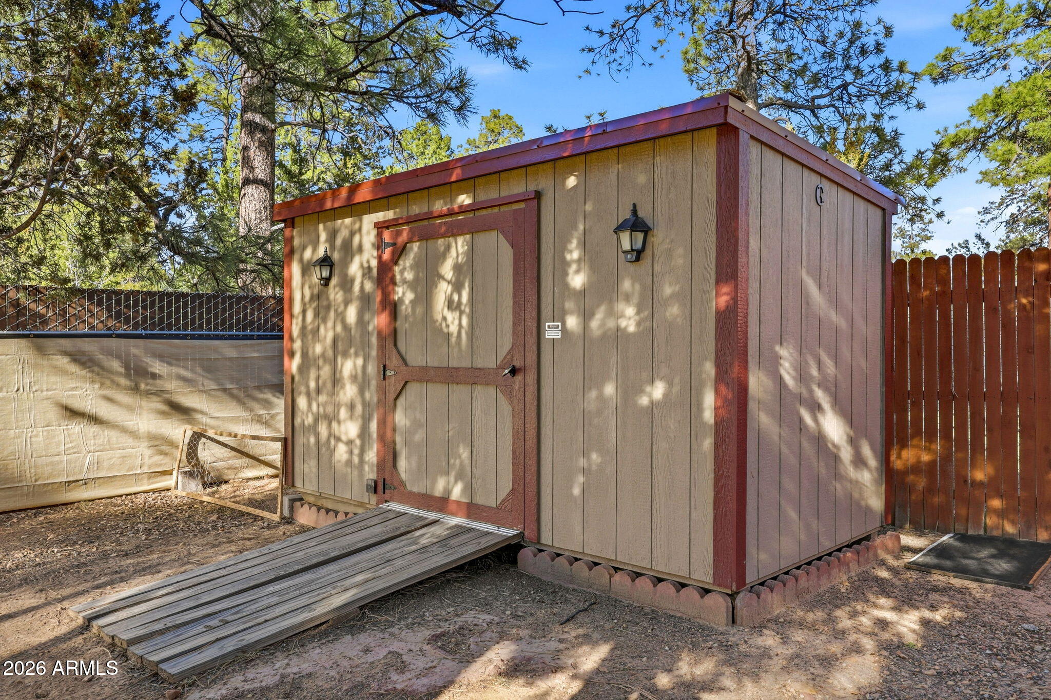 1980 Pine Cone Circle Overgaard, AZ 85933 - Photo 29 of 30 a front view of a house with a yard
