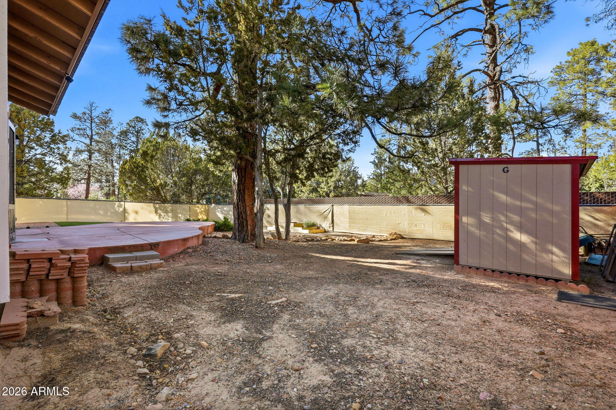1980 Pine Cone Circle Overgaard, AZ 85933 - Photo 30 of 30 a backyard of a house with yard and outdoor seating