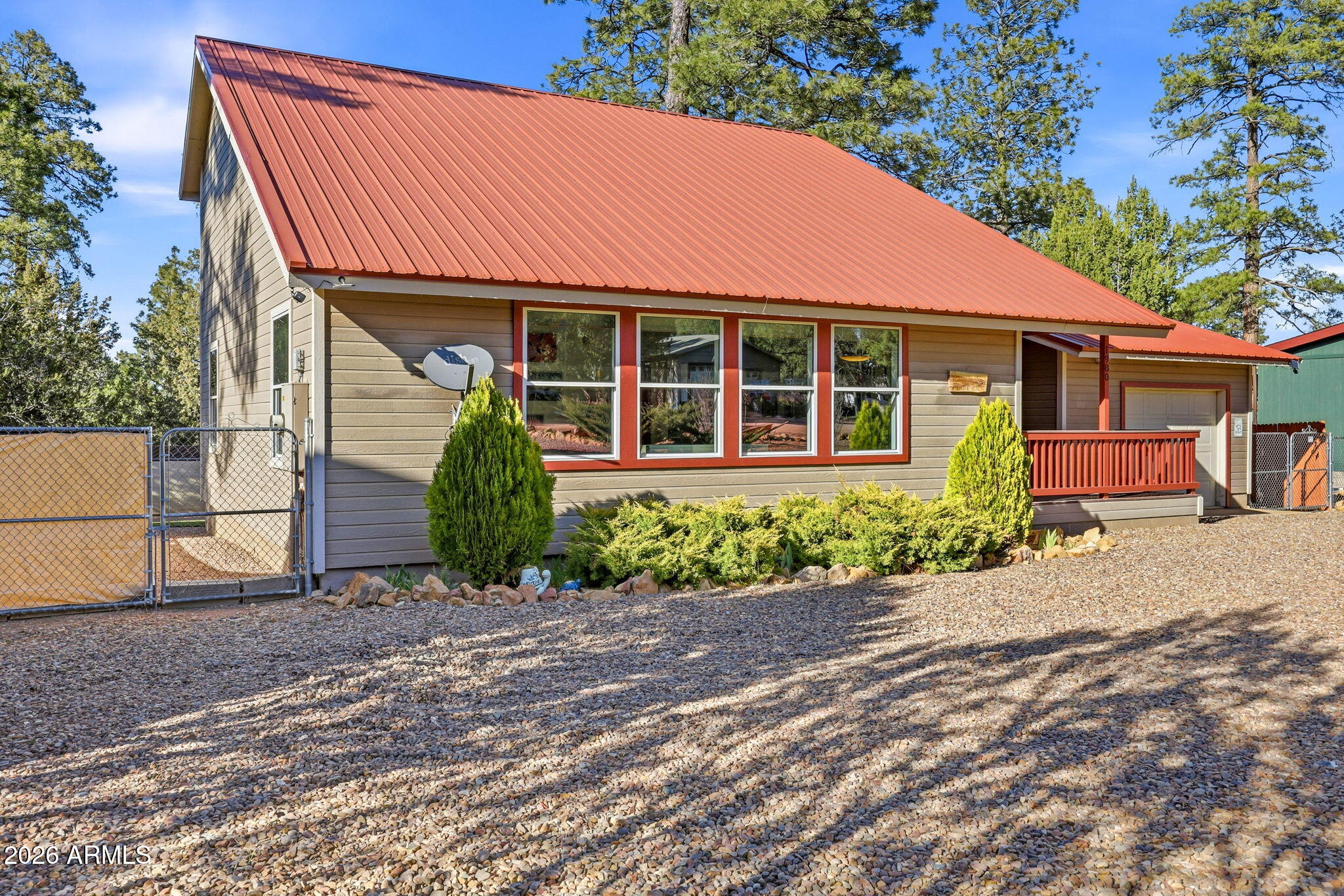 1980 Pine Cone Circle Overgaard, AZ 85933 - Photo 3 of 30 a front view of a house with garden