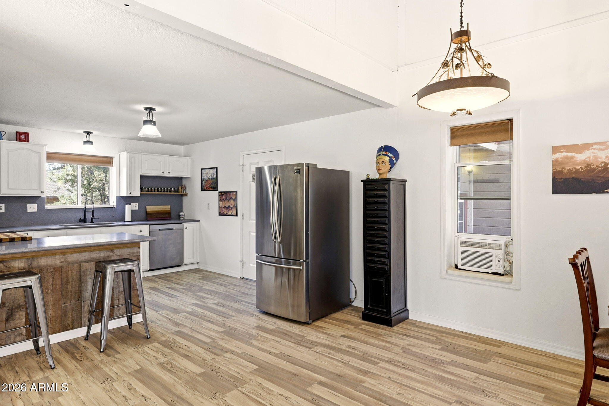 1980 Pine Cone Circle Overgaard, AZ 85933 - Photo 10 of 30 a kitchen with stainless steel appliances granite countertop a refrigerator and a stove top oven