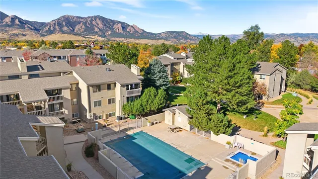 a kitchen with a refrigerator and a stove top oven