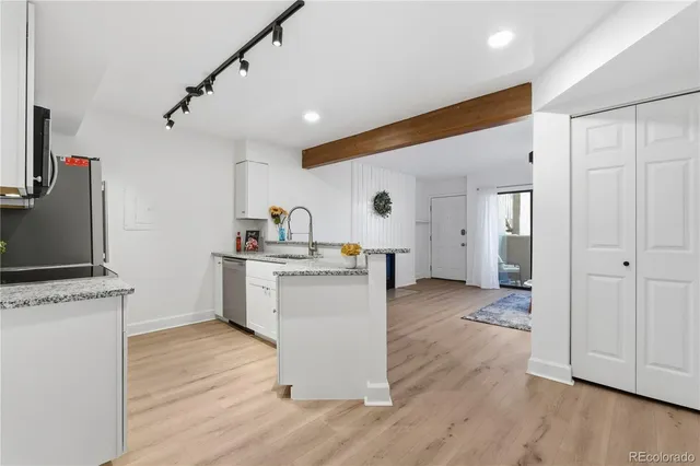 a spacious bedroom with a bed and a shower