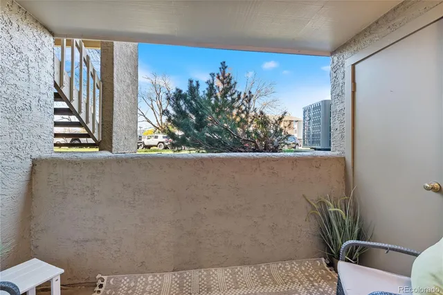 a front view of a residential apartment building with a yard