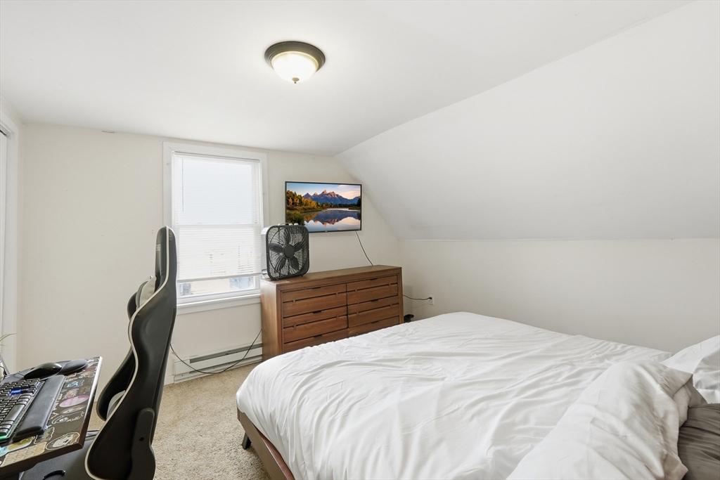 57 Davenport Street Springfield, MA 01119 - Photo 12 of 21 a bedroom with a bed and a desk