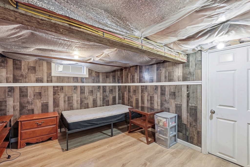 57 Davenport Street Springfield, MA 01119 - Photo 17 of 21 a balcony with wooden benches and glass door