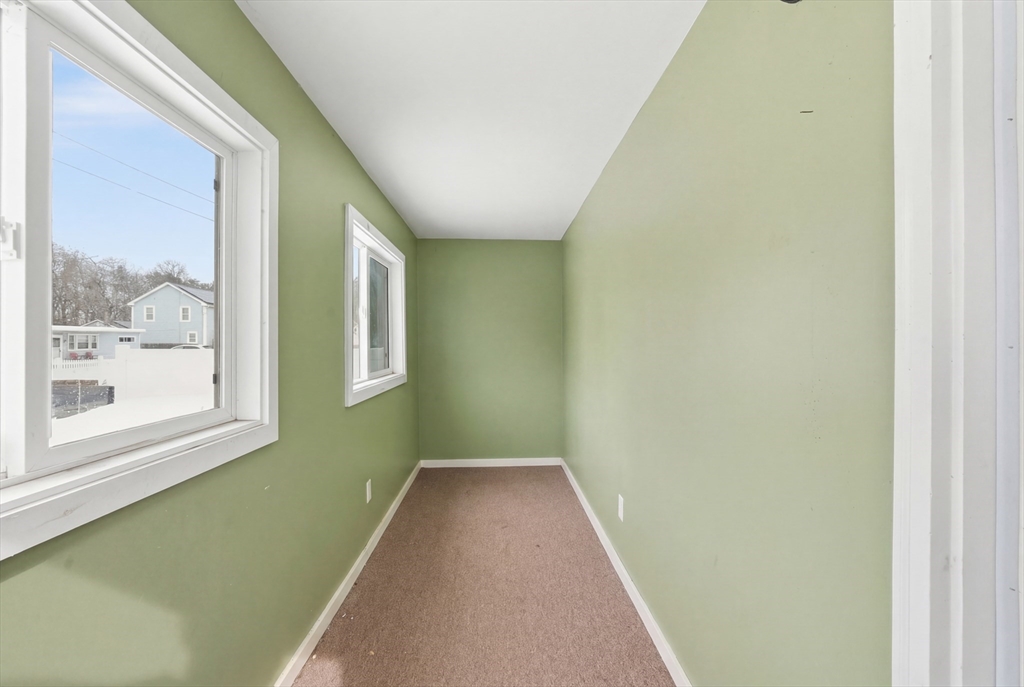 57 Davenport Street Springfield, MA 01119 - Photo 3 of 21 a view of a hallway with a window