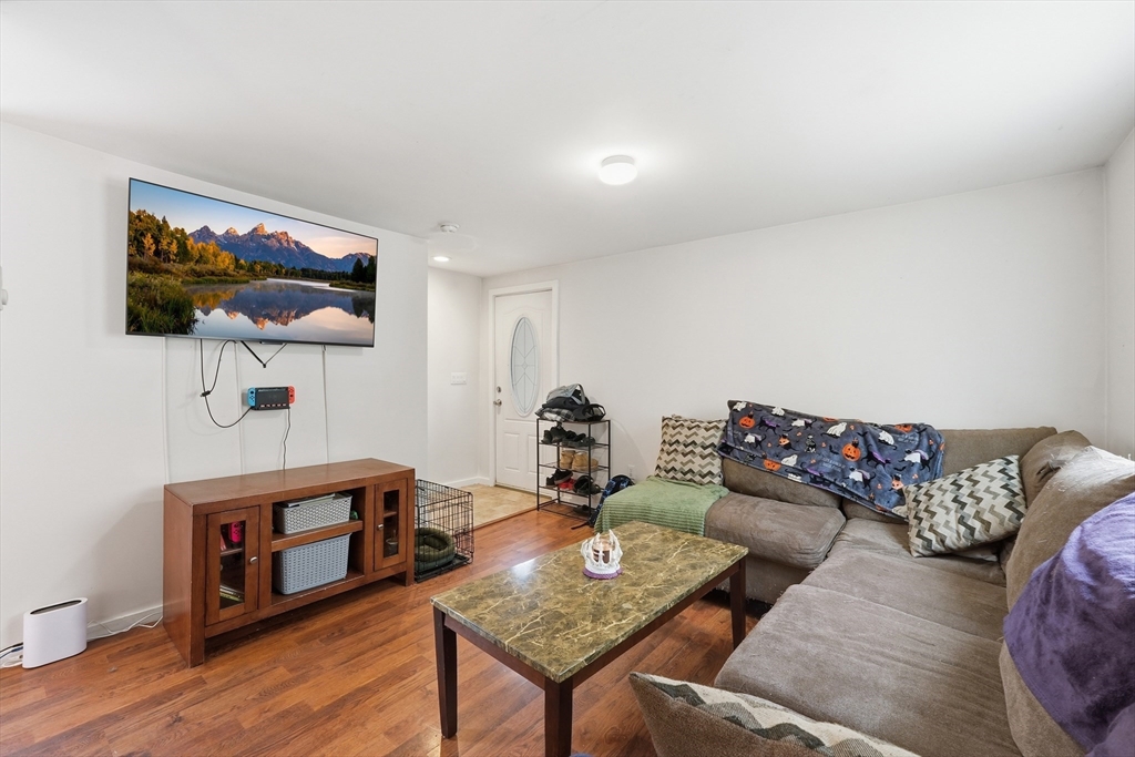 57 Davenport Street Springfield, MA 01119 - Photo 4 of 21 a living room with furniture and a flat screen tv