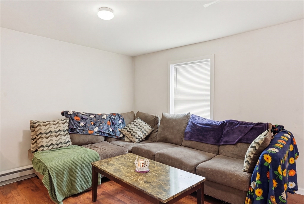57 Davenport Street Springfield, MA 01119 - Photo 5 of 21 a living room with furniture and a couch