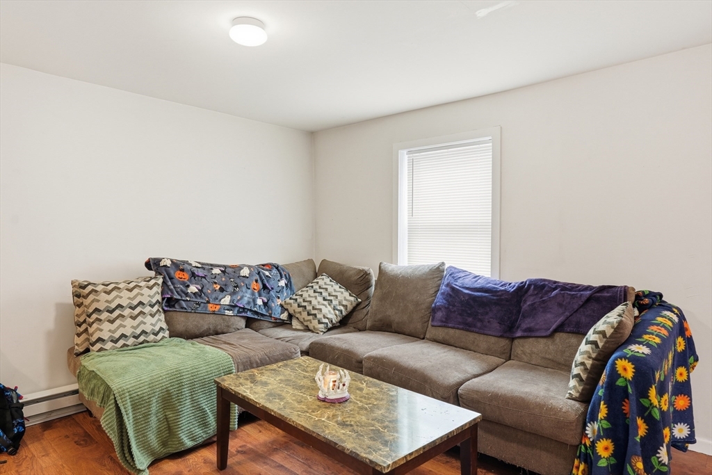 57 Davenport Street Springfield, MA 01119 - Photo 7 of 21 a living room with a couch and a coffee table