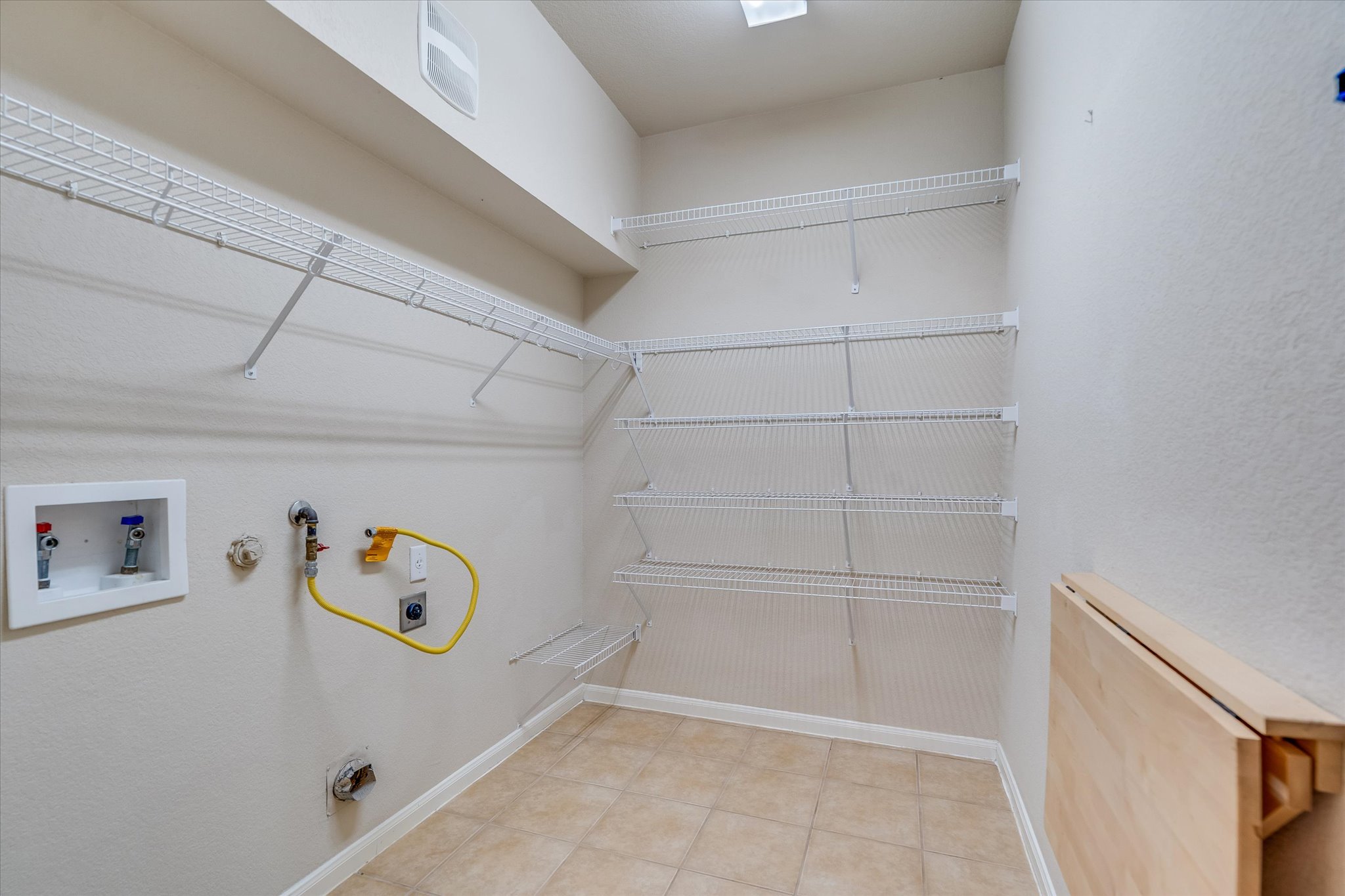 4029 Lake Edge Way Pflugerville, TX 78660 - Photo 11 of 35 a view of storage and utility room with racks on the wall