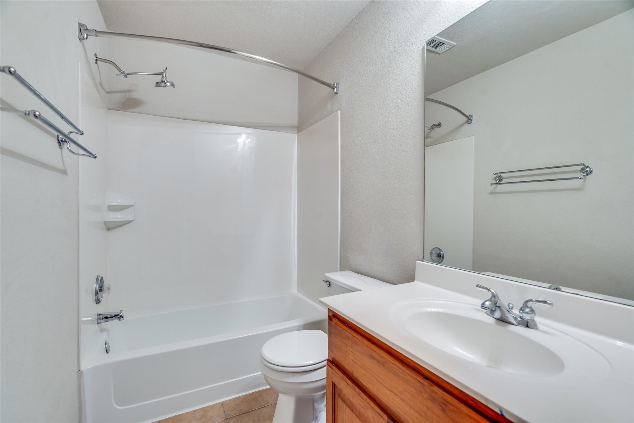 4029 Lake Edge Way Pflugerville, TX 78660 - Photo 17 of 35 a bathroom with a sink toilet and shower