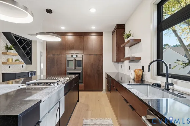 a stove top oven sitting next to a window