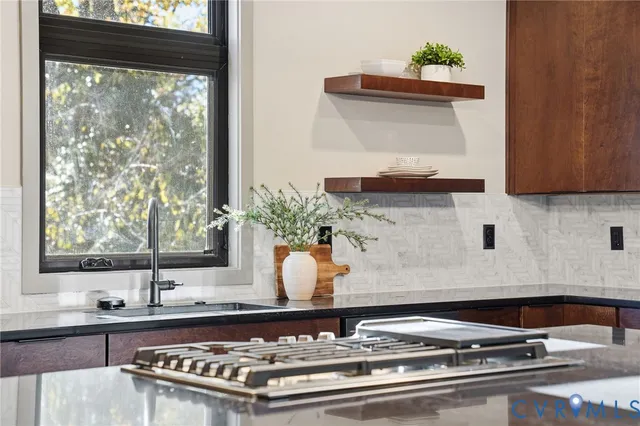a kitchen with a sink cabinets and window
