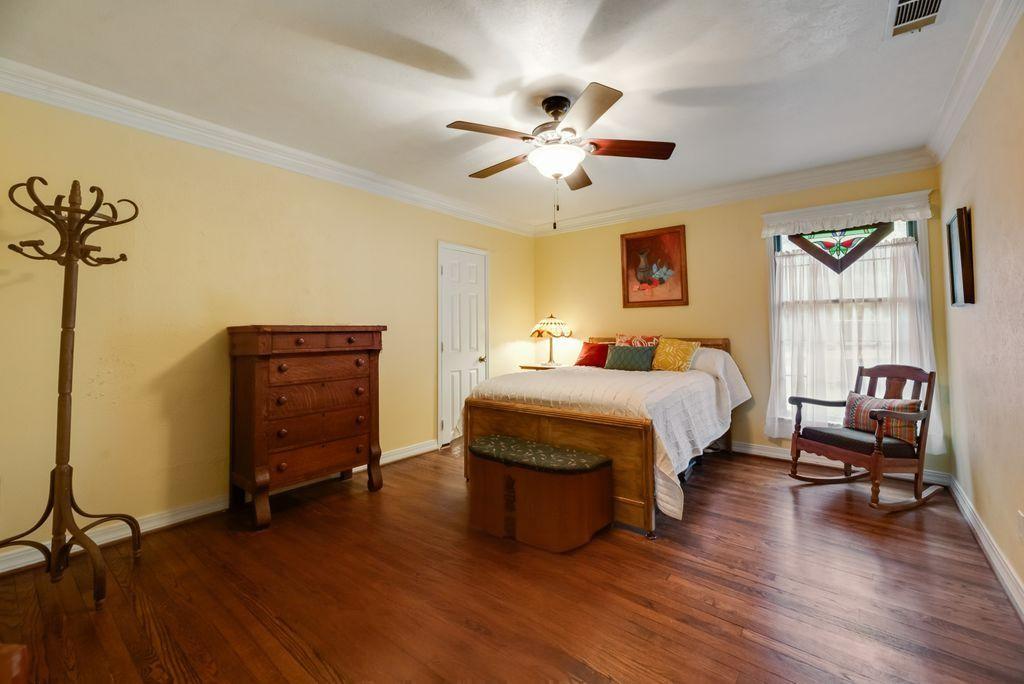 9875 Old Bridge Road Terrell, TX 75160 - Photo 20 of 40 a bedroom with a bed and wooden floor