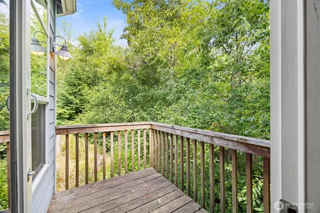 an empty room with closet and a window