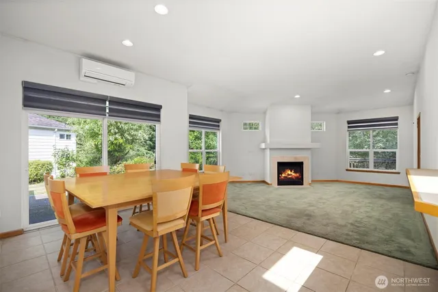 a view of a dining room with furniture and a window
