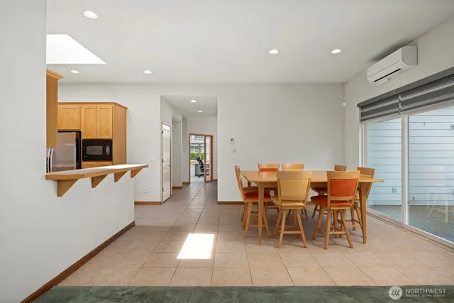 a view of a dining room with furniture and window