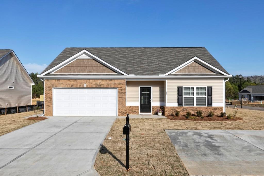 4 Willowrun Drive Rome, GA 30165 - Photo 1 of 1 a front view of a house with a yard and garage