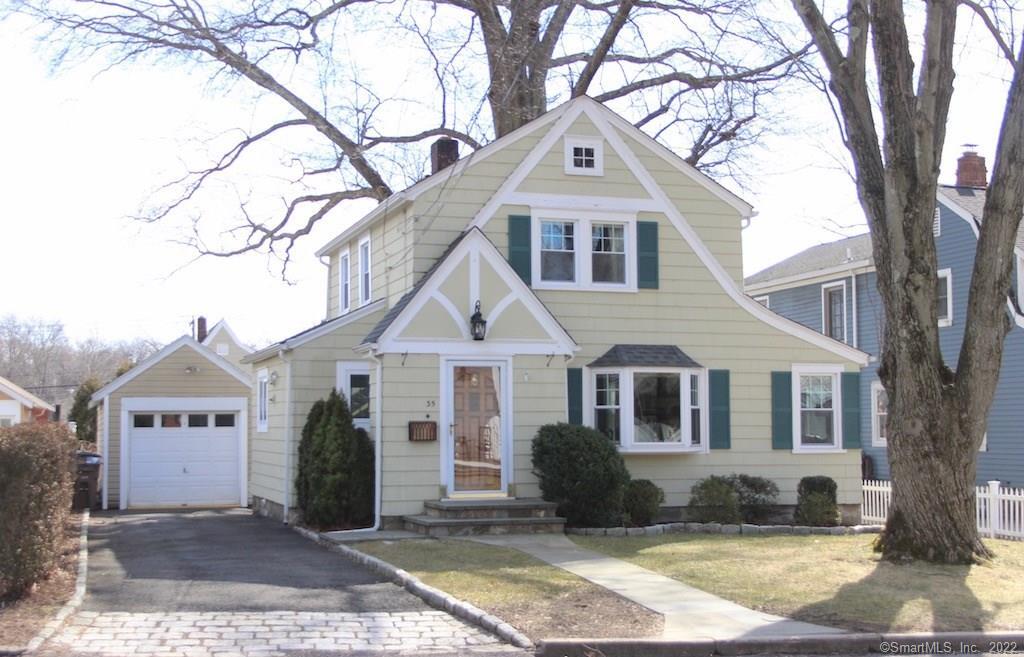 35 Windsor Road Stamford, CT 06905 - Photo 1 of 1 a front view of a house with a yard