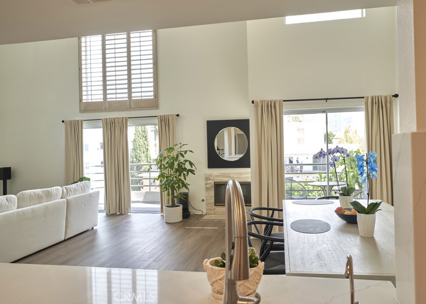 1617 South Beverly Glen Boulevard, Unit 303 Los Angeles, CA 90024 - Photo 16 of 55 a living room with furniture and a large window